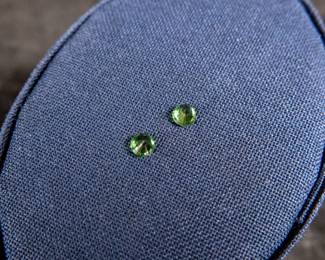 Two Tsavorite gems, marked as 3.5mm with a .37ct weight.