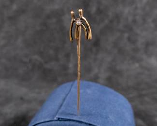 14kt gold stick pin, wishbones with a small seed pearl. Approx. weight is 1.56 grams and measures 3'' long.