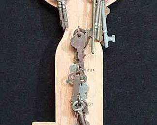 Antique Key Collection On Wooden Key Rack
