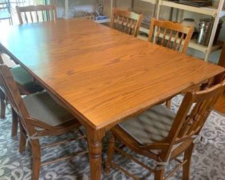 Amana Furniture Shop made dining room table and 6 chairs. 30 x 45 x 71. Also comes with 2 leaves 45 x 12 each and table pads