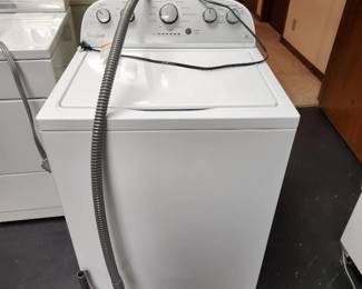 Whirlpool HE washing machine (located on lower level-has access to garage)