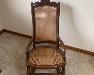 Rocking chair with wicker back and bottom