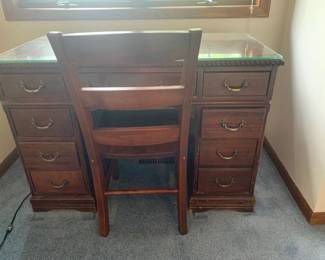 Vintage wooden desk and chair. With 8 drawers and glass top. 30 x 44 x 22
