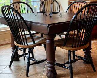 Substantial dark wood table, 6 Windsor chairs