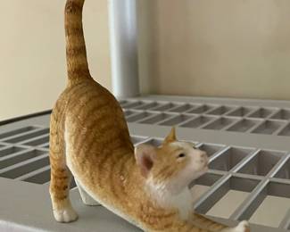 Cute cat stretching figure