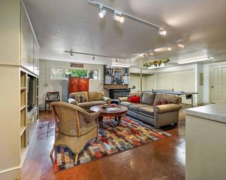 Down in the Game Room...Commercial Carpet. Rattan Chair.  Microfiber Sofa and Love Sofa. Standing Tool Chest. And more! 