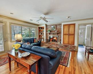 Beautiful Dark Blue Leather Sofas. Lots of fabulous Persian Carpets. 