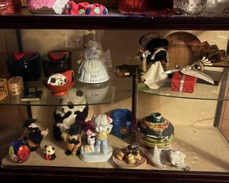 Small figurines and a table top display case