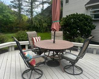Small patio table round with 4 swivel chairs and umbrella and base stand