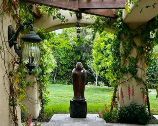 Large Asian sculpture on wood base  