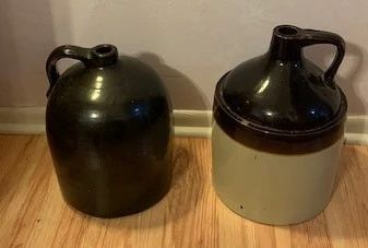 Antique Whiskey Jugs (large) - Jug on left is brown salt glazed stoneware primitive beehive