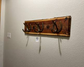Hand made coat hanger with horse shoe hooks