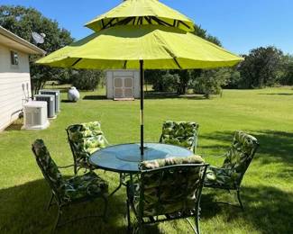 We moved the table and chairs off the covered patio so we could set up the umbrella.