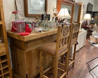 Rustic style bar with lots of storage and metal foot rest