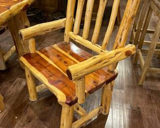 One of the two carver log chairs