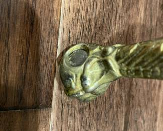 The ball and claw foot of the piano stool