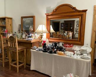 Looking at the bar and glass ware table, wonderful large rustic style mirror
