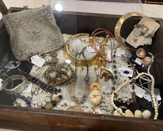This showcase contains, hand made pieces, designer collar, ivory, and bone, vintage jewelry