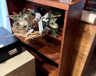 bookcase, file cabinet, wreath