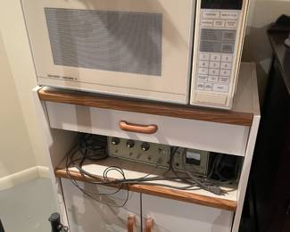 . . . microwave on microwave stand and vintage epilator