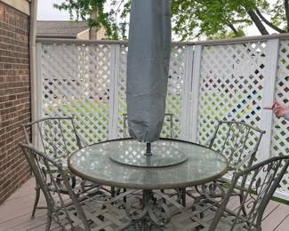 . . . table and chairs with umbrella