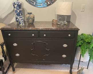 . . . marble-topped sideboard