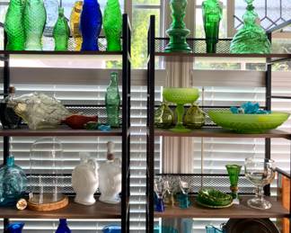 Shelves  full of Various Color , Shapes  and Sizes Bottle Collection Antique to Modern 

