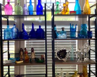 Shelves  full of Various Color , Shapes  and Sizes Bottle Collection Antique to Modern 
