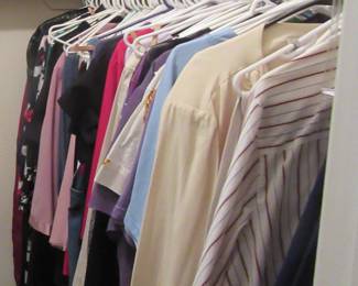 One side of closet, ladies clothing, some has new tags.