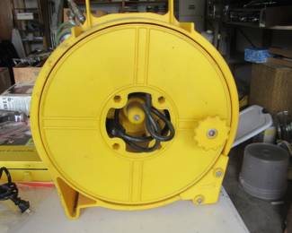 Long extension cord and roll up holder.