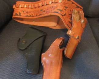 Tooled gun belt and holster, one black US holster and one Biance tan holster. NO guns or ammo.