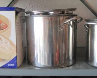 Large stainless pots and bamboo steamer.