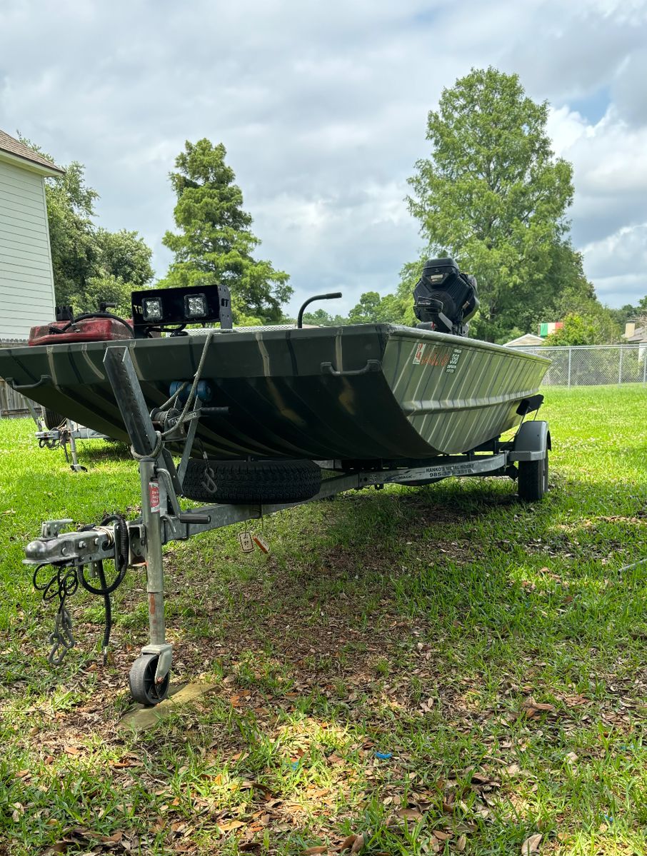 Flat bottom with GatorTail motor and trailer 
