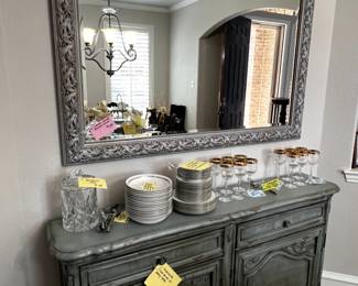 beautiful side hutch and serving pieces and glass ware