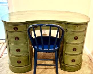 Green kidney shaped desk with blue chair 
