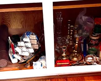 Cupboard filled with candle stick holders & misc. 
