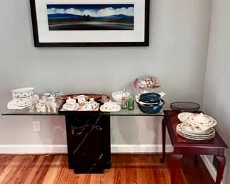 Glass topped table with sturdy black marble base