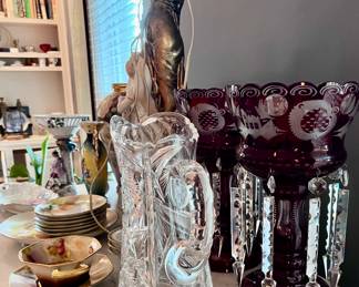 Ruby red etched glass mantle lustres. Etched decorative glass jug. Porcelain cups and saucers. 