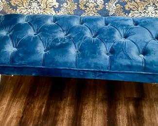 Blue button quilted bench