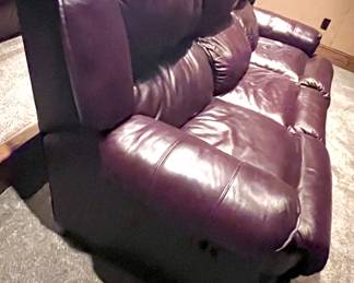Maroon leather sofa movie room