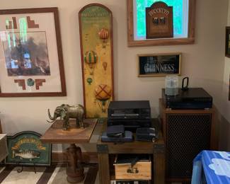 Man cave items with vintage stereo and wooden tables