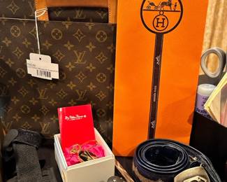Louis Vuitton Monogram Executive Briefcase, Hermes gift boxes, Sandy Dufler Designs belt, Bear Grylls Gerber camping knife