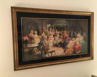 Large framed print hung over sofa