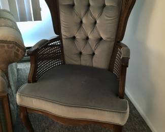 Light-blue velvet tufted, partially-caned arm chair