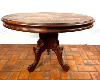 Antique Victorian period Walnut parlor table that has been cut down to become a coffee table, most likely in the 1940s 50s