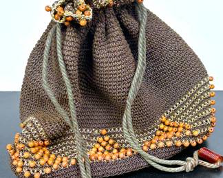 1940s drawstring purse with a plastic faux tortoise bottom 