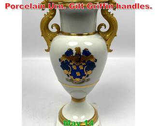 Lot 424 French Decorated Porcelain Urn. Gilt Griffin handles.