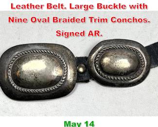 Lot 18 Signed AR Concho on Black Leather Belt. Large Buckle with Nine Oval Braided Trim Conchos. Signed AR.