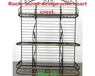 Lot 538 Tall Iron and Brass Bakers Rack. Scroll design with heart crest. 