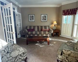 Upholstered chairs and couch with  wood coffee  and end table 